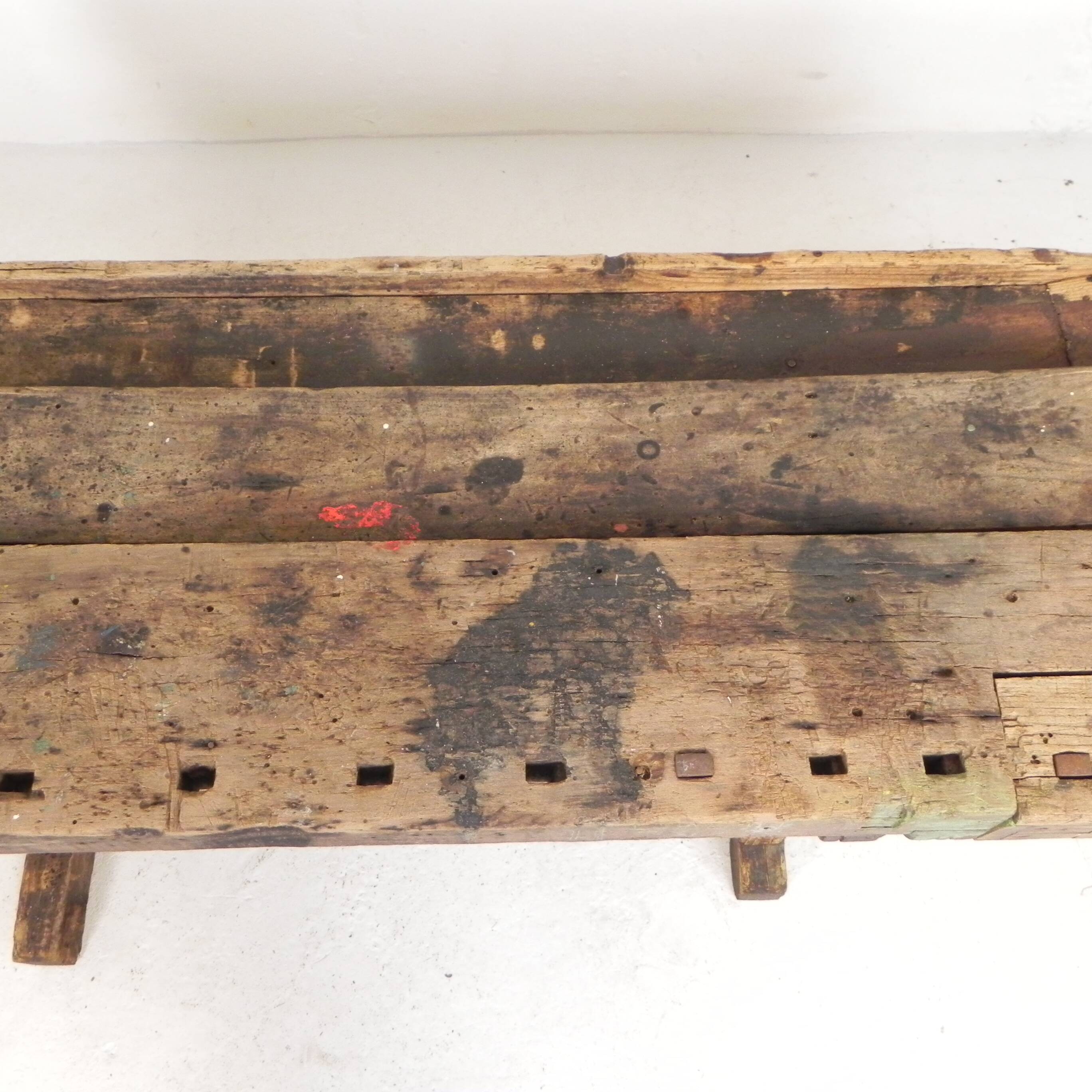 Wooden industrial workbench with vice, 194 cm long, 1930s.