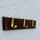 Vintage wooden and brass coat rack with 3 hooks from the 1960s.