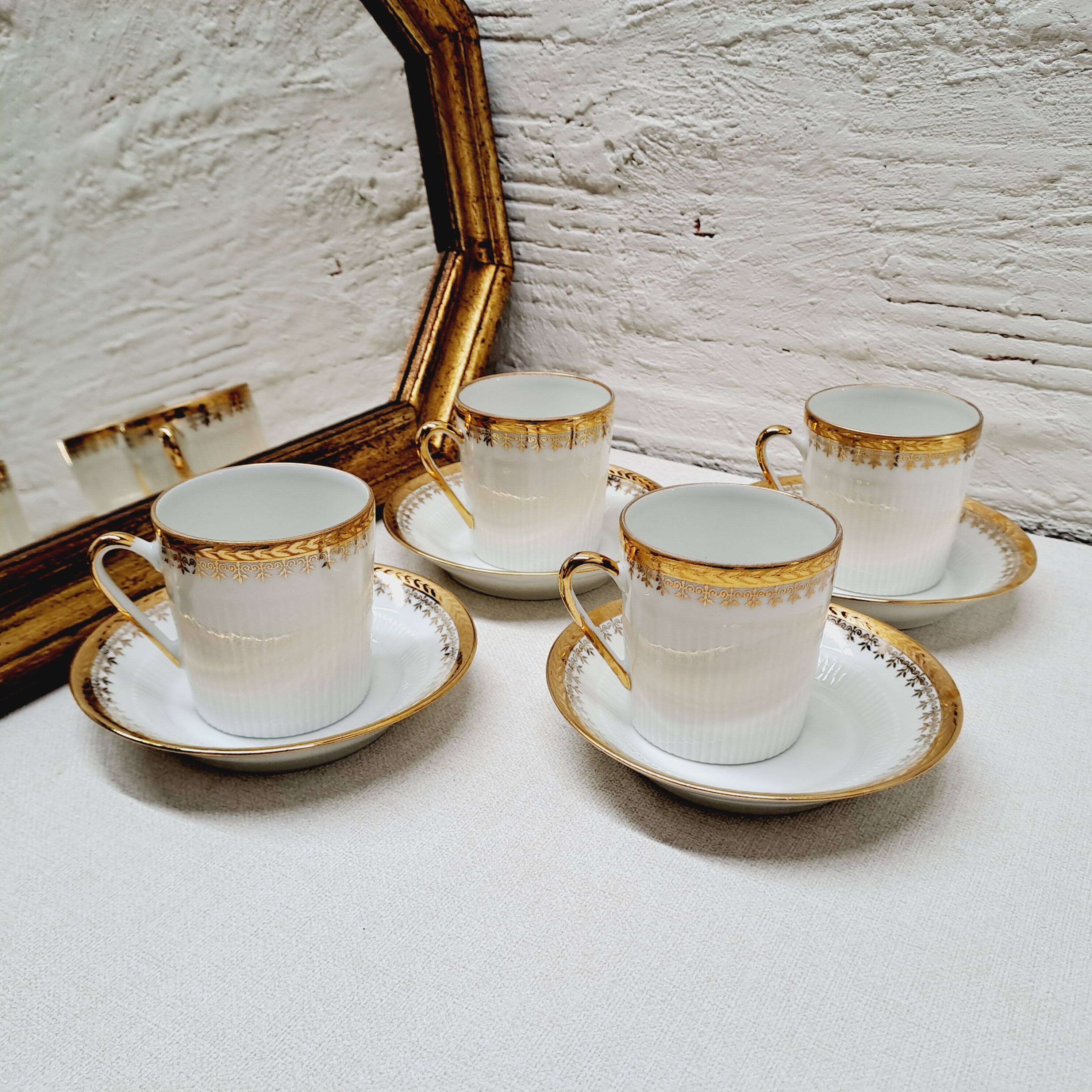 White and gold porcelain coffee maker and cups