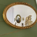 Miroir mural ovale doré