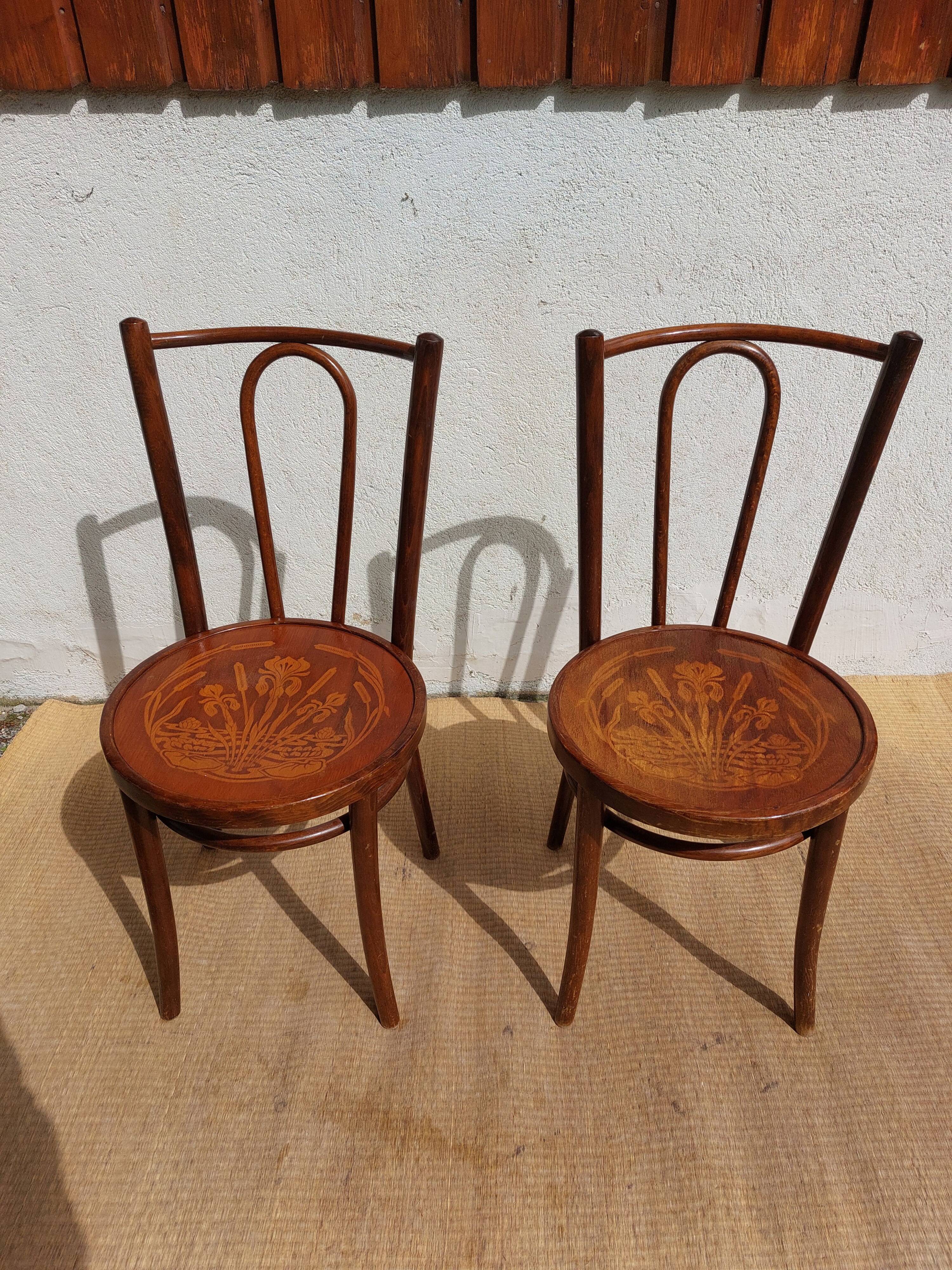 pair of bistro chairs, curved wood and pattern on the seat