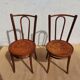 pair of bistro chairs, curved wood and pattern on the seat