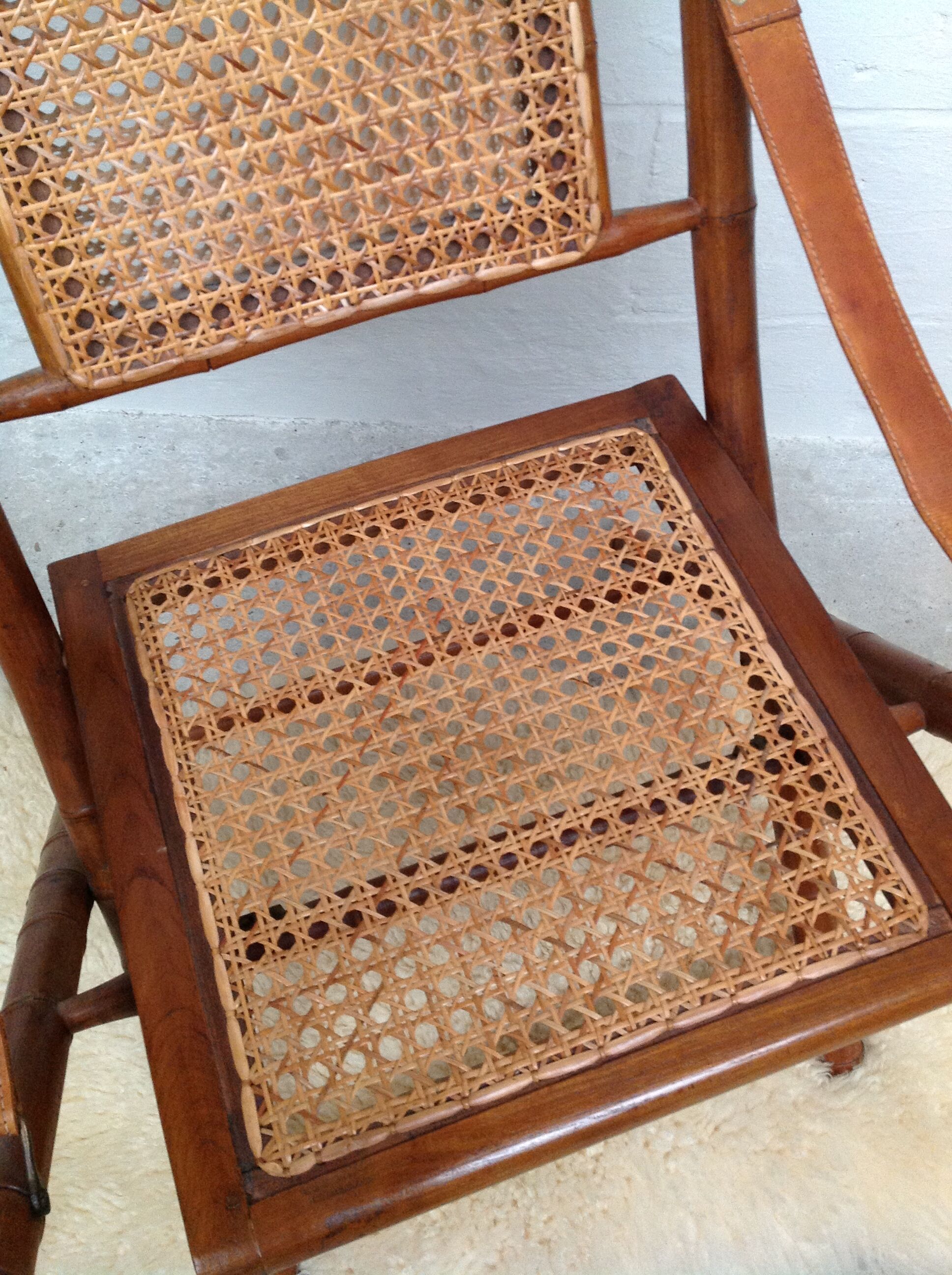 Bamboo folding armchair and caning, leather and brass