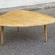 Scandinavian coffee table in the shape of a pebble/bean made of light solid wood from the years.