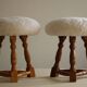 Modern Danish, a pair of tripod stools, seats reupholstered in lambswool, 1950s.