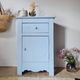 Handcrafted blue chest of drawers.