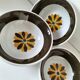 Set of three Italian deep plates from the 1970s, with ochre brown floral decoration.