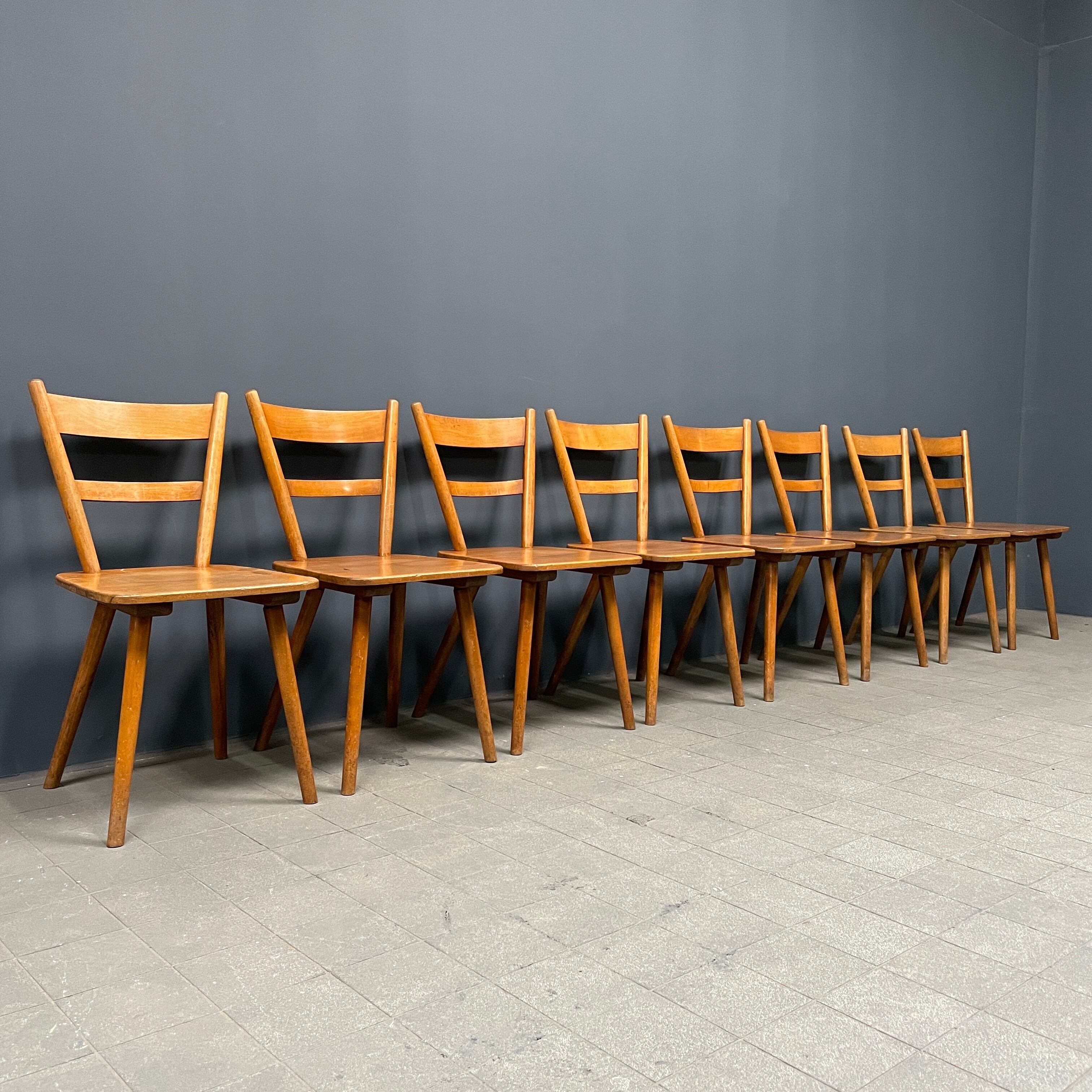 Set of eight german stick chairs from the 1950