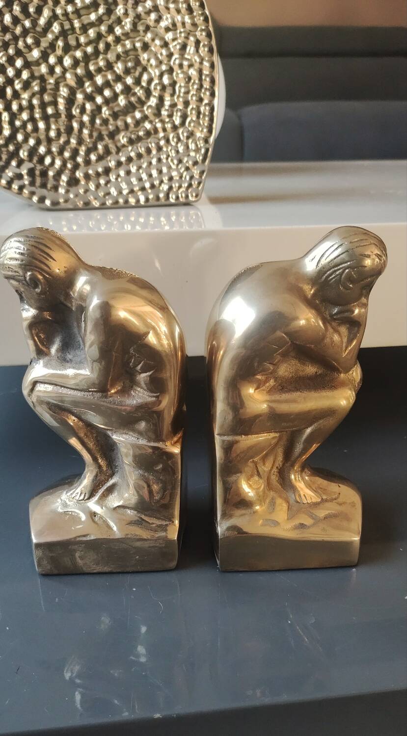 Pair of bookends inspired by Rodin's The Thinker. In gilt bronze