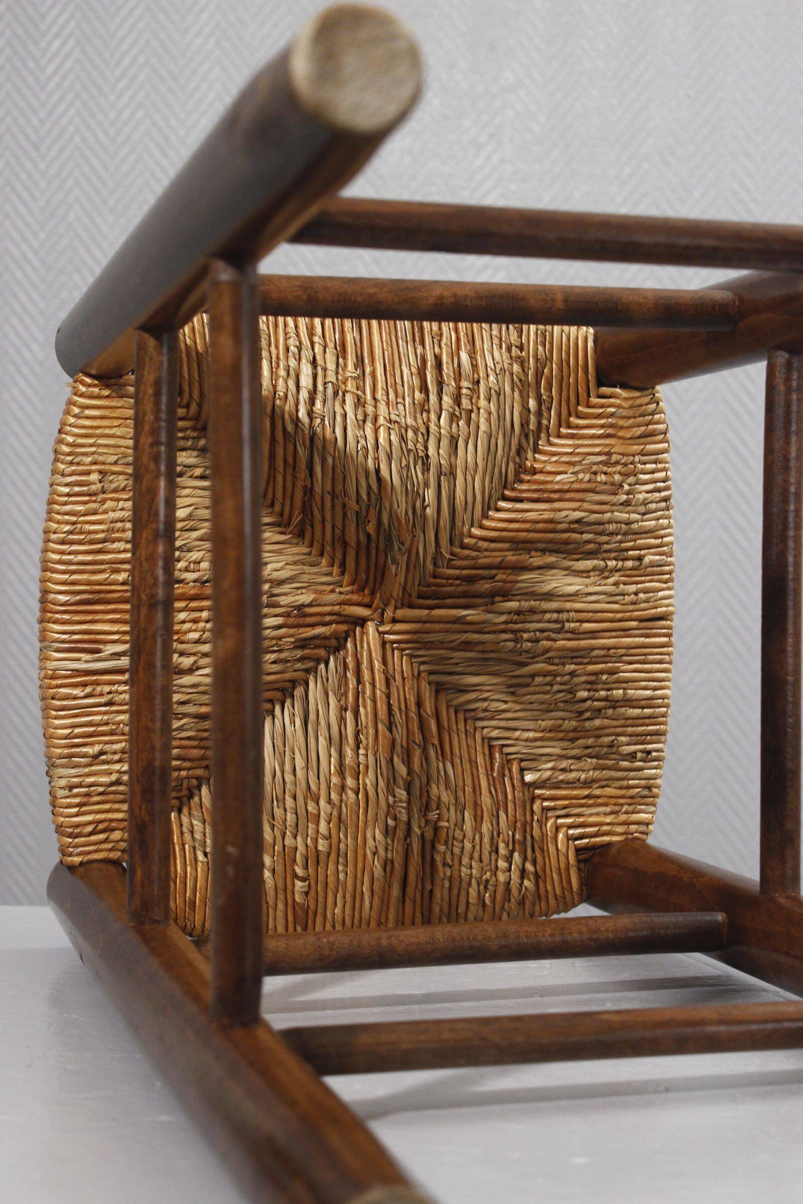 Vintage straw stool in the style of Charlotte Perriand, 1970s.