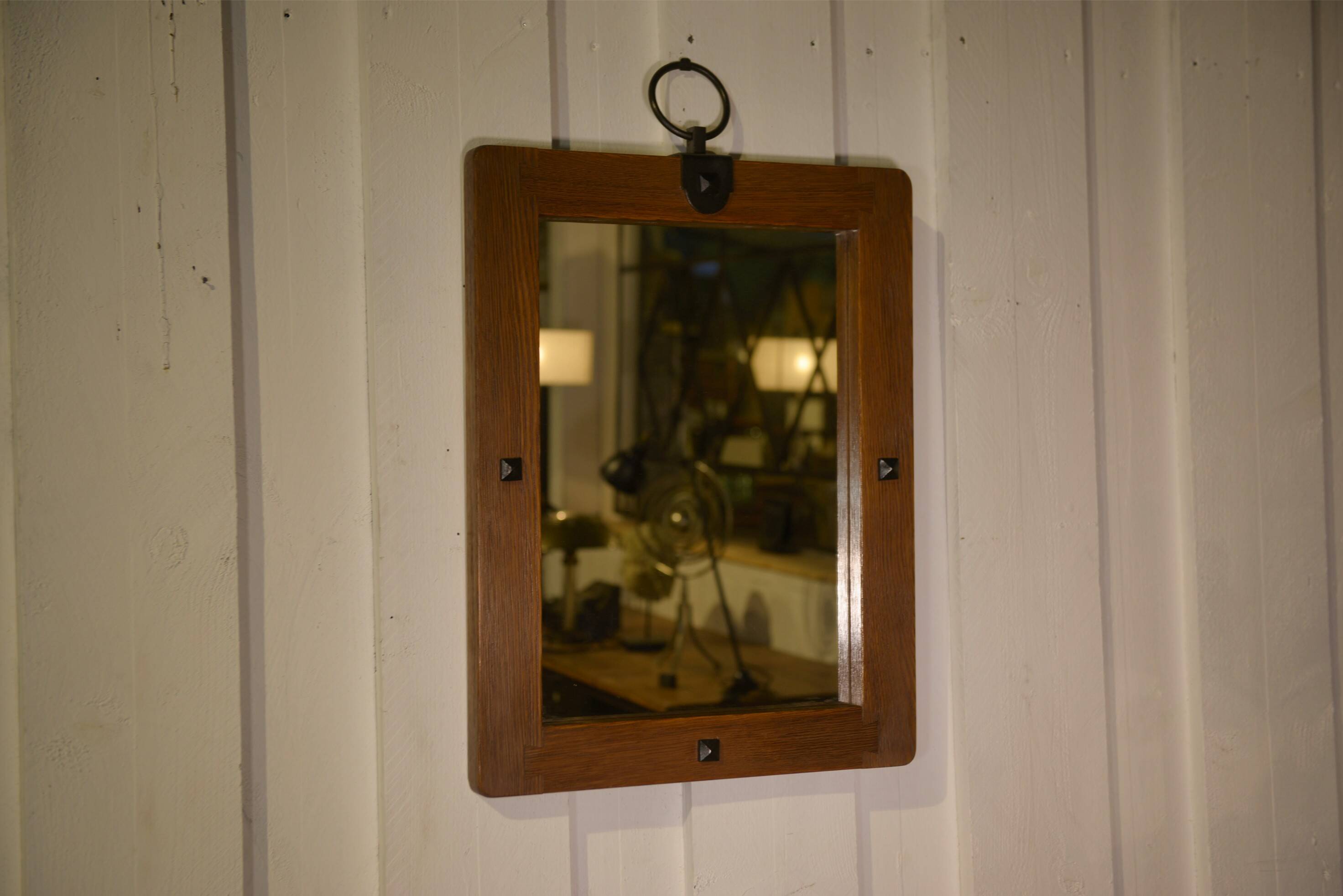 Brutalist mirror in solid oak with metal ring, 1960s.