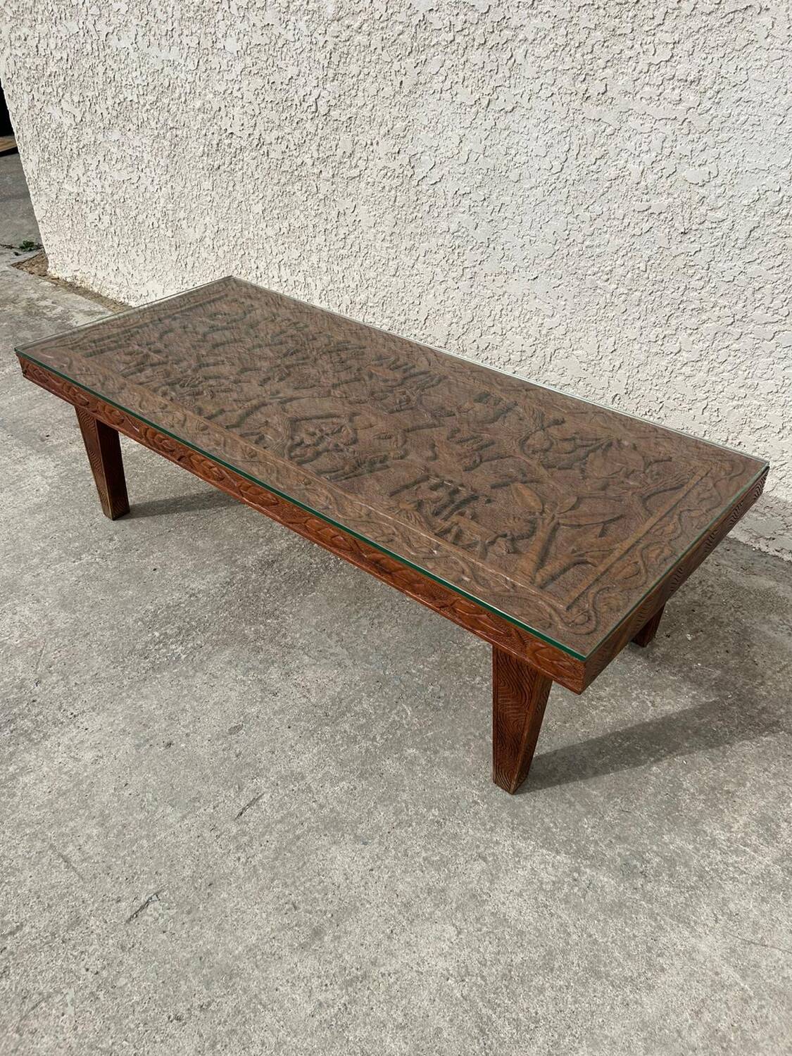 Afro style carved wooden table with glass top
