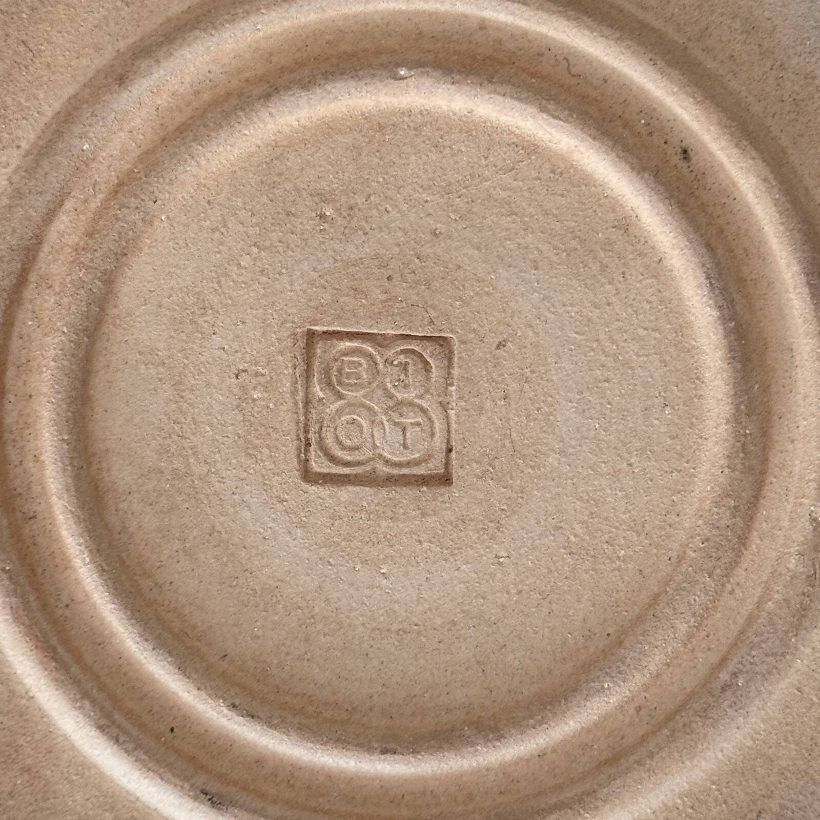 Round glazed earthenware dish by Biot, 20th century, stylized decoration
