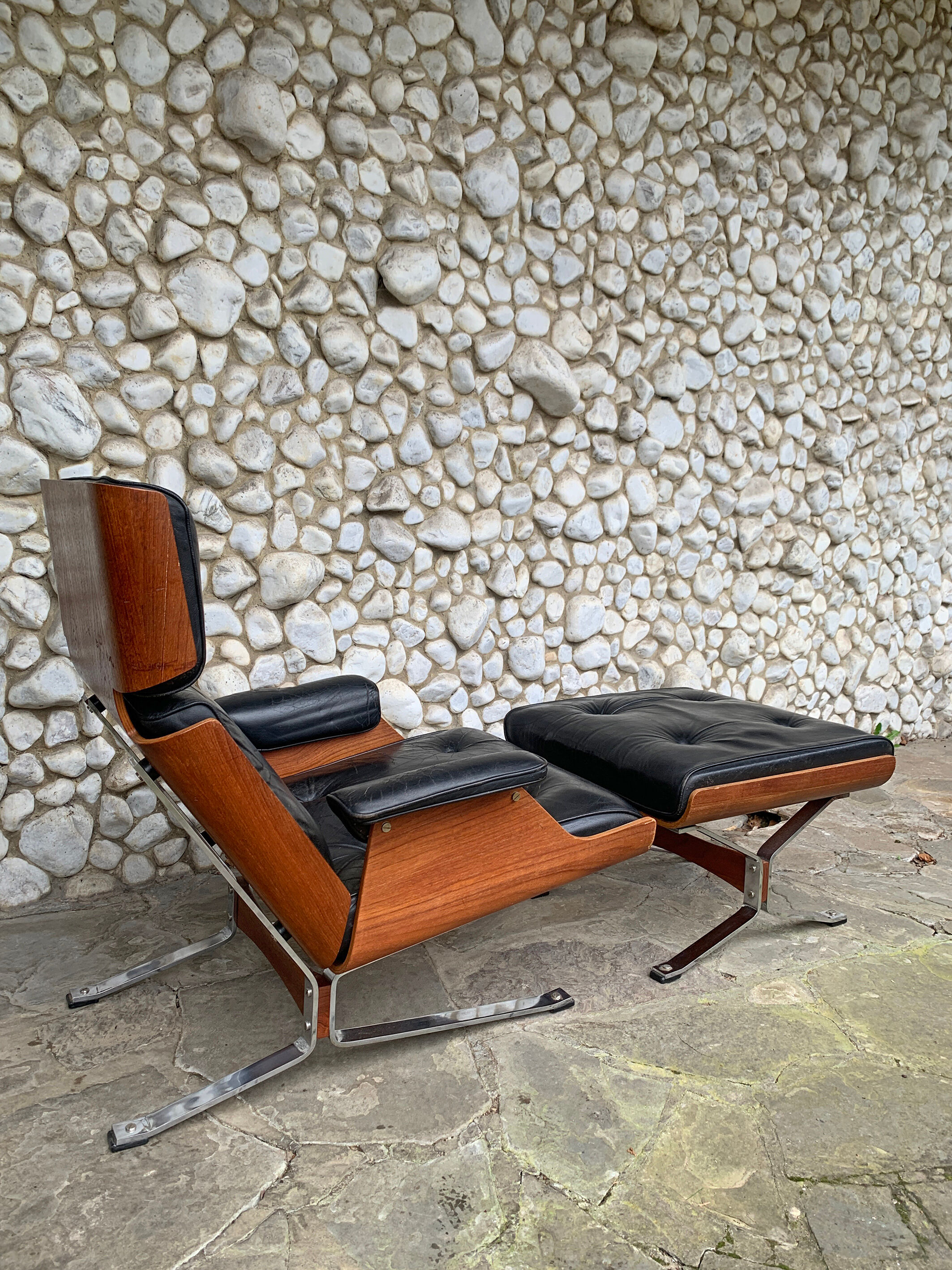 Lounge chair and ottoman black leather and teak multiplex, 1960