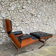 Lounge chair and ottoman black leather and teak multiplex, 1960