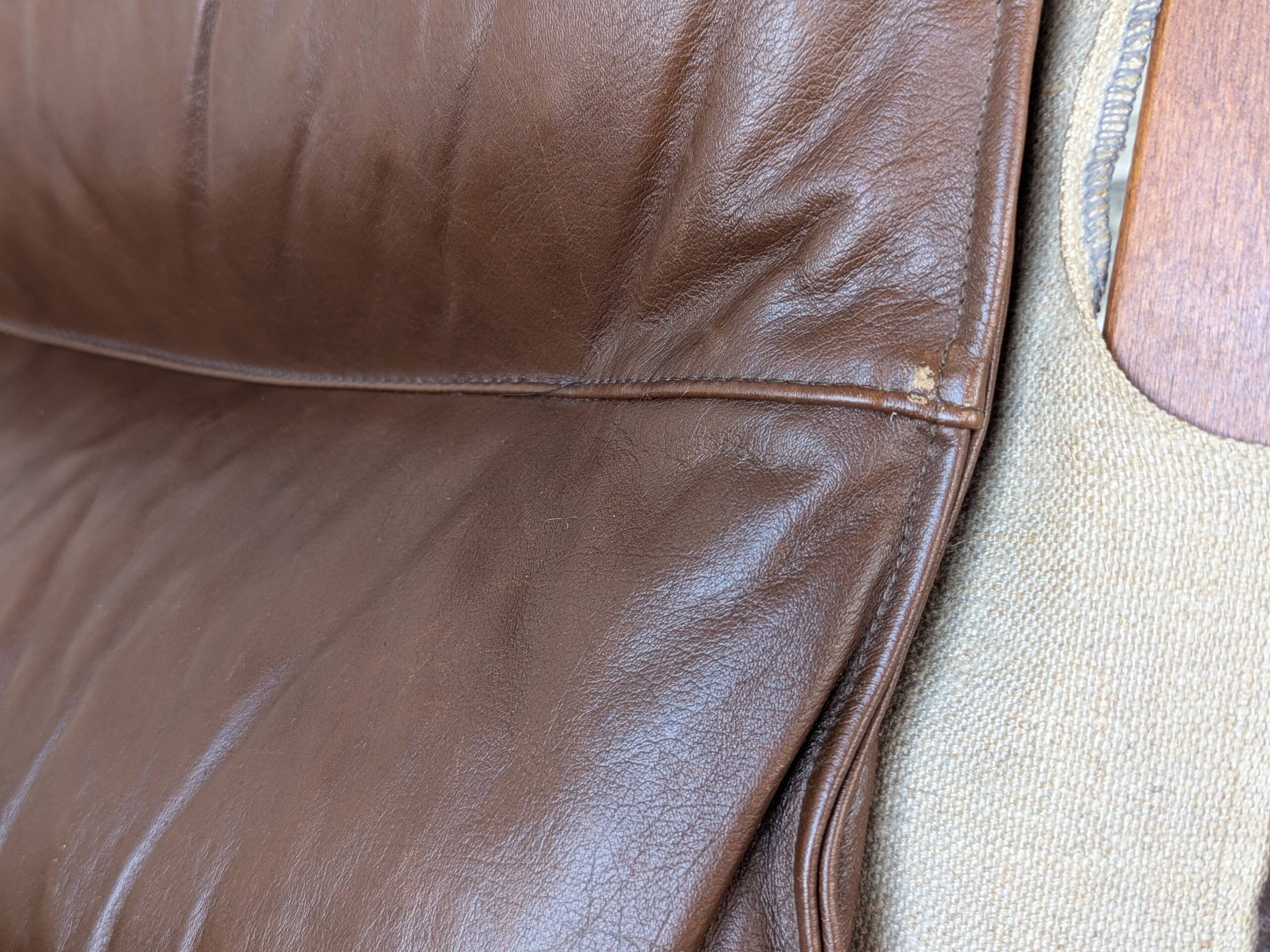 Leather and wood armchair, brutalist style.