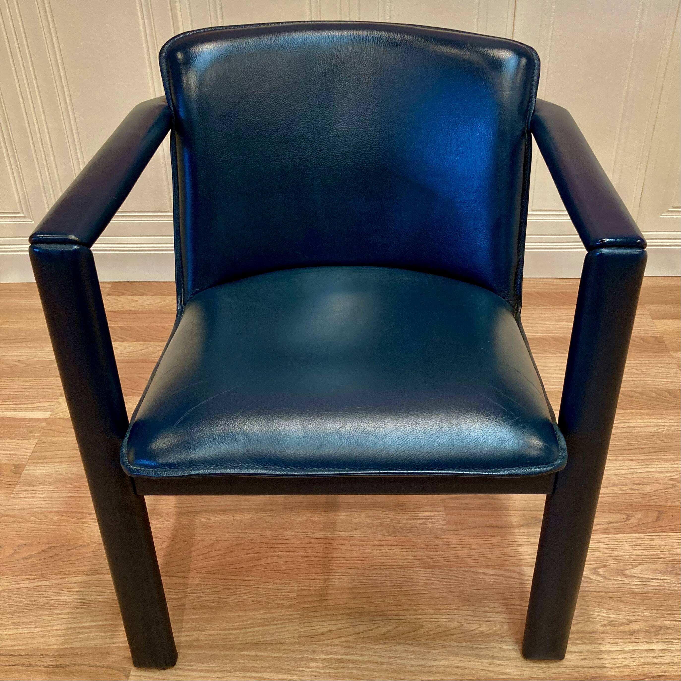 Set of 3 designer leather and metal armchairs.