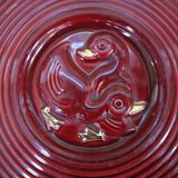 Vintage burgundy duck trivet with gold edging