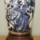 Ceramic lamp with Asian decoration with matching lampshade.