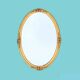 Antique oval wall mirror in gold resin - 63 cm
