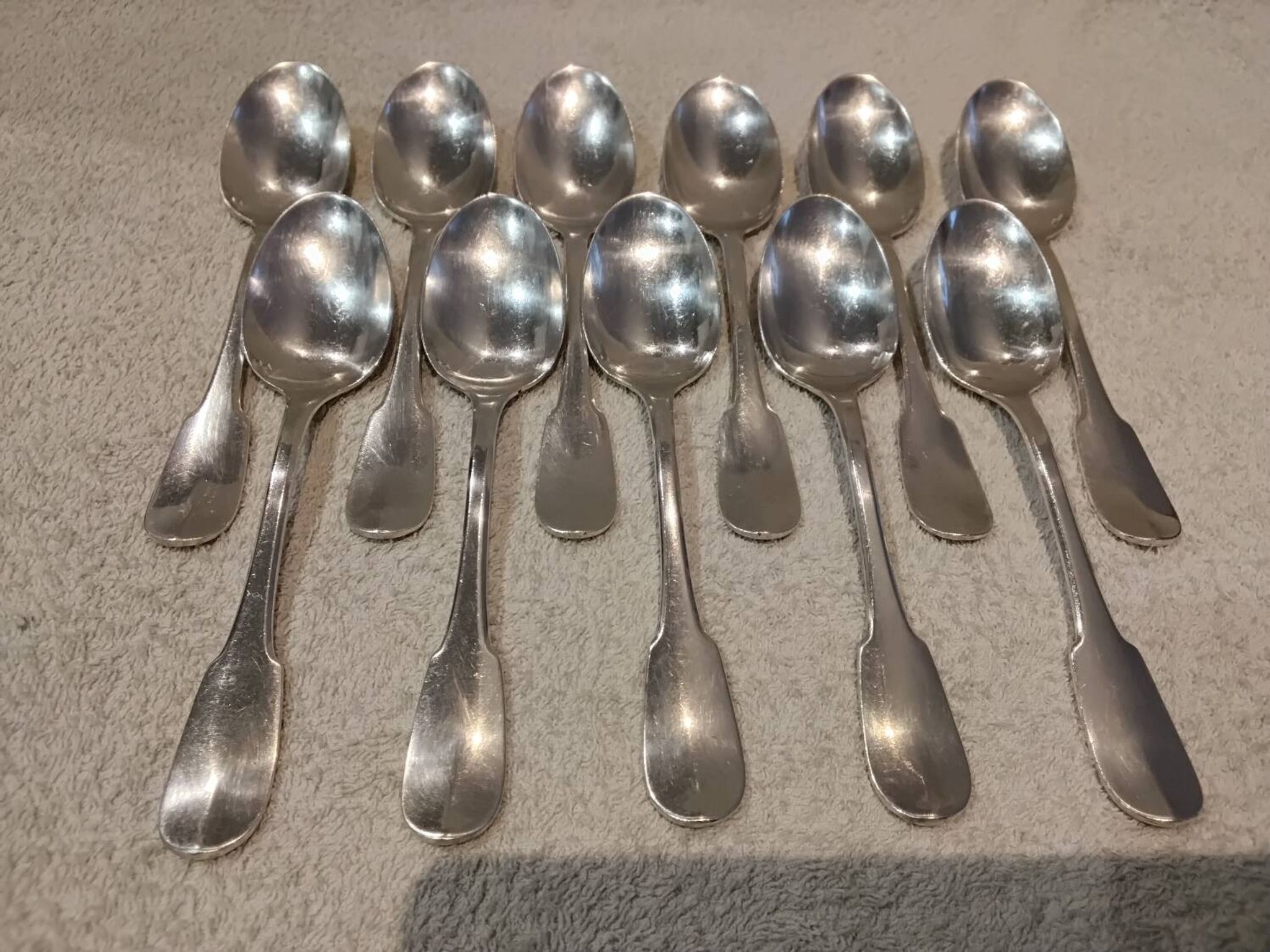 11 silver-plated dessert spoons by Christofle, Cluny pattern, striped
