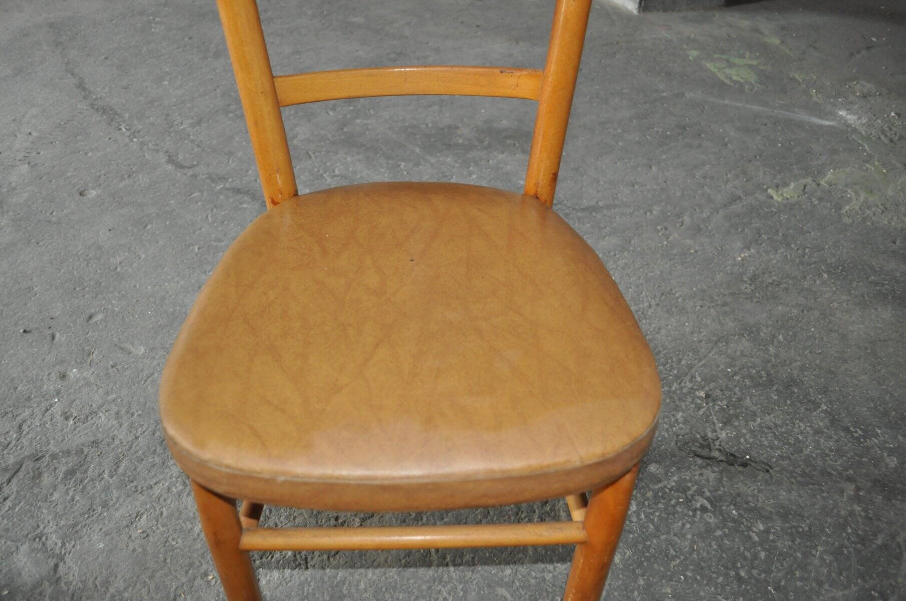 Vintage chair in brown faux leather and light wood, 1960s, padded seat.