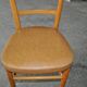 Vintage chair in brown faux leather and light wood, 1960s, padded seat.