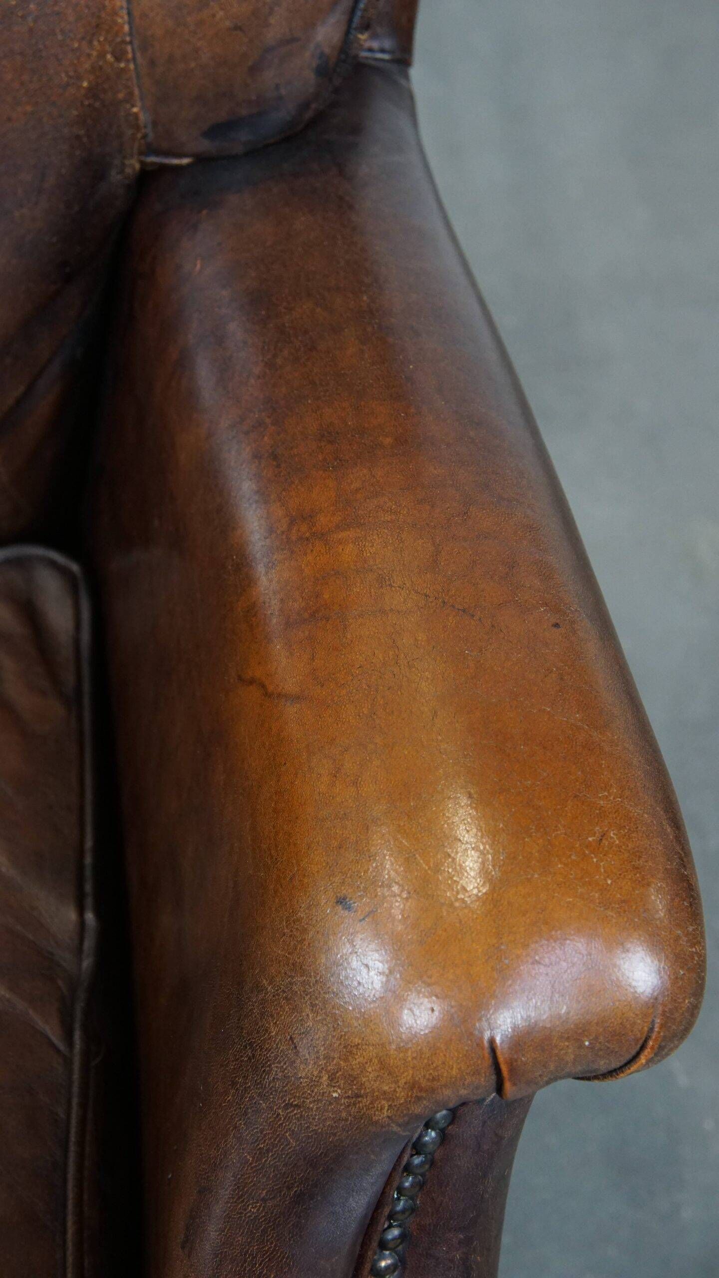 Vintage sheepskin armchair in a dark cognac colour with a comfortable seat
