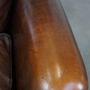 Vintage sheepskin armchair in a dark cognac colour with a comfortable seat