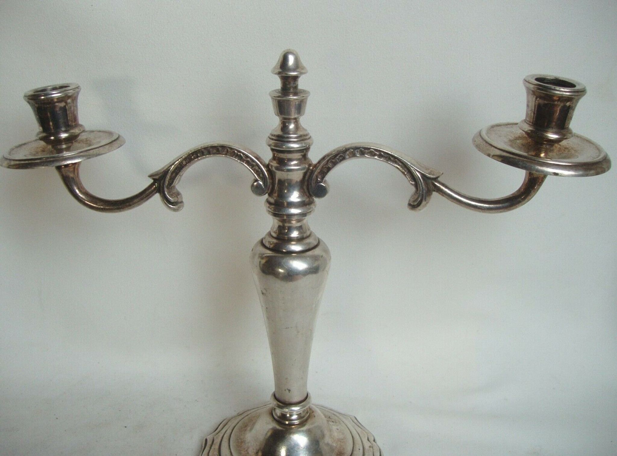 Two-branch silver-plated candle holder from the early twentieth century.
