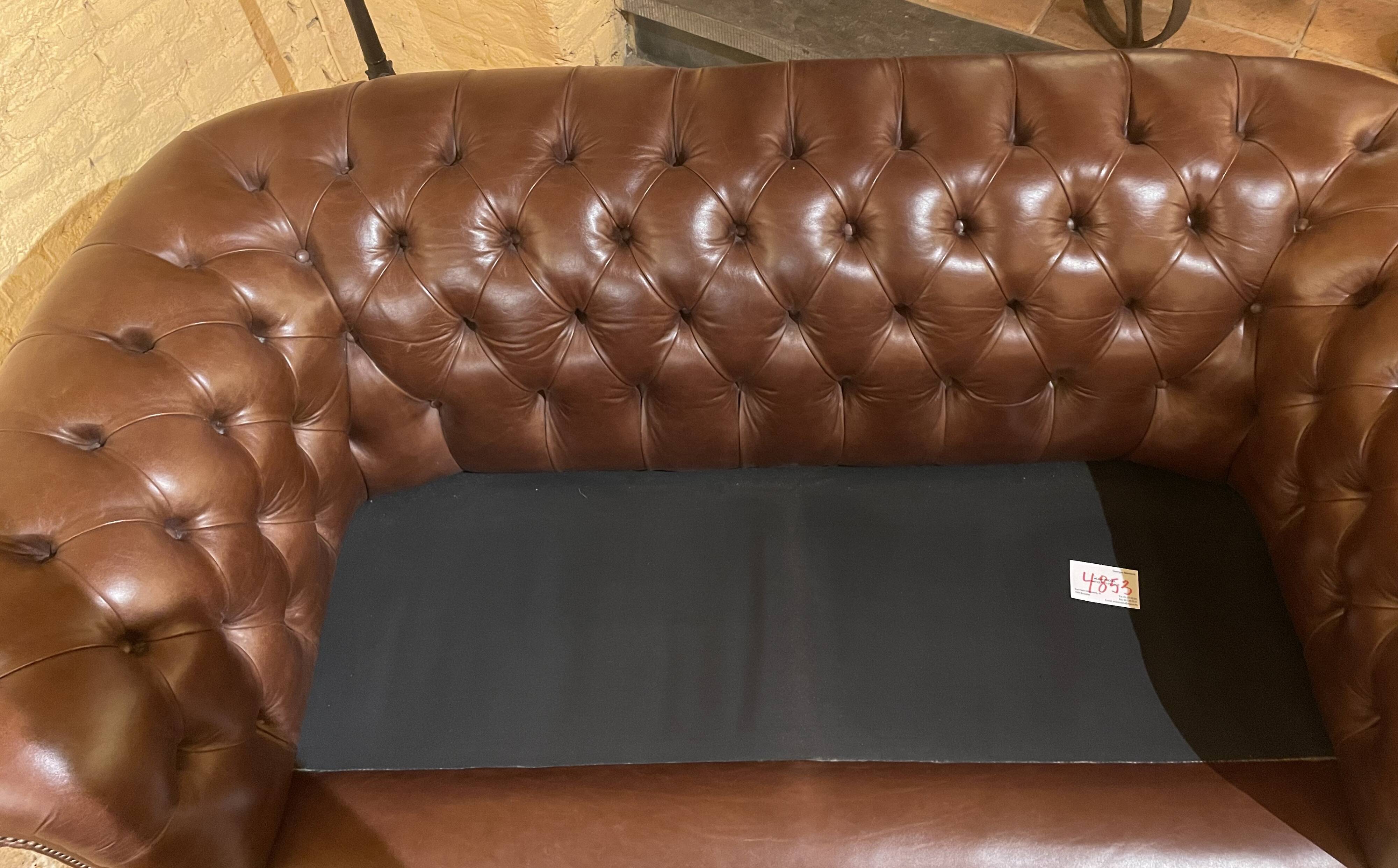 brown leather 2-seater Chesterfield sofa