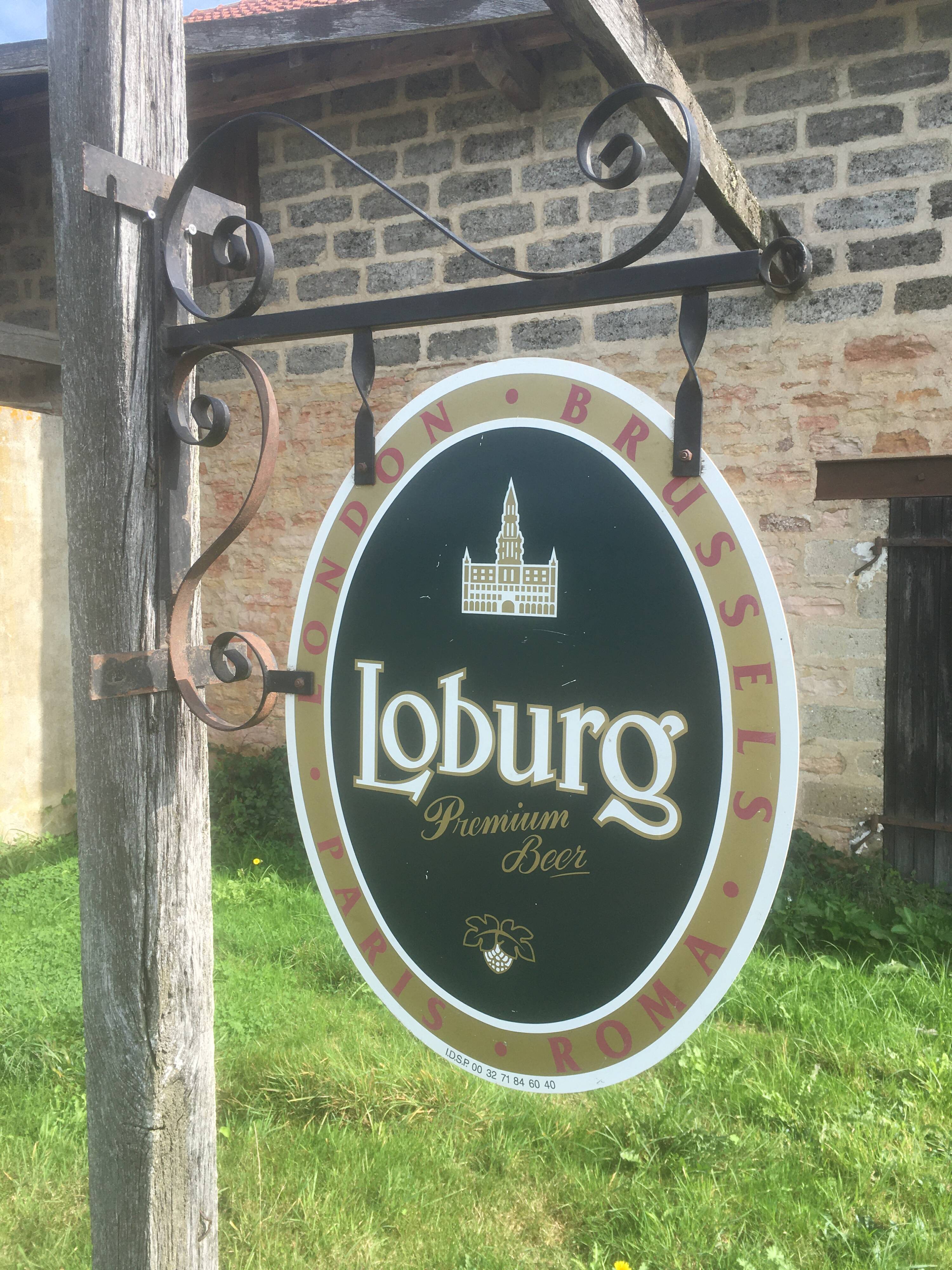 Double-sided "Loburg Beer" metal sign on wrought iron bracket
