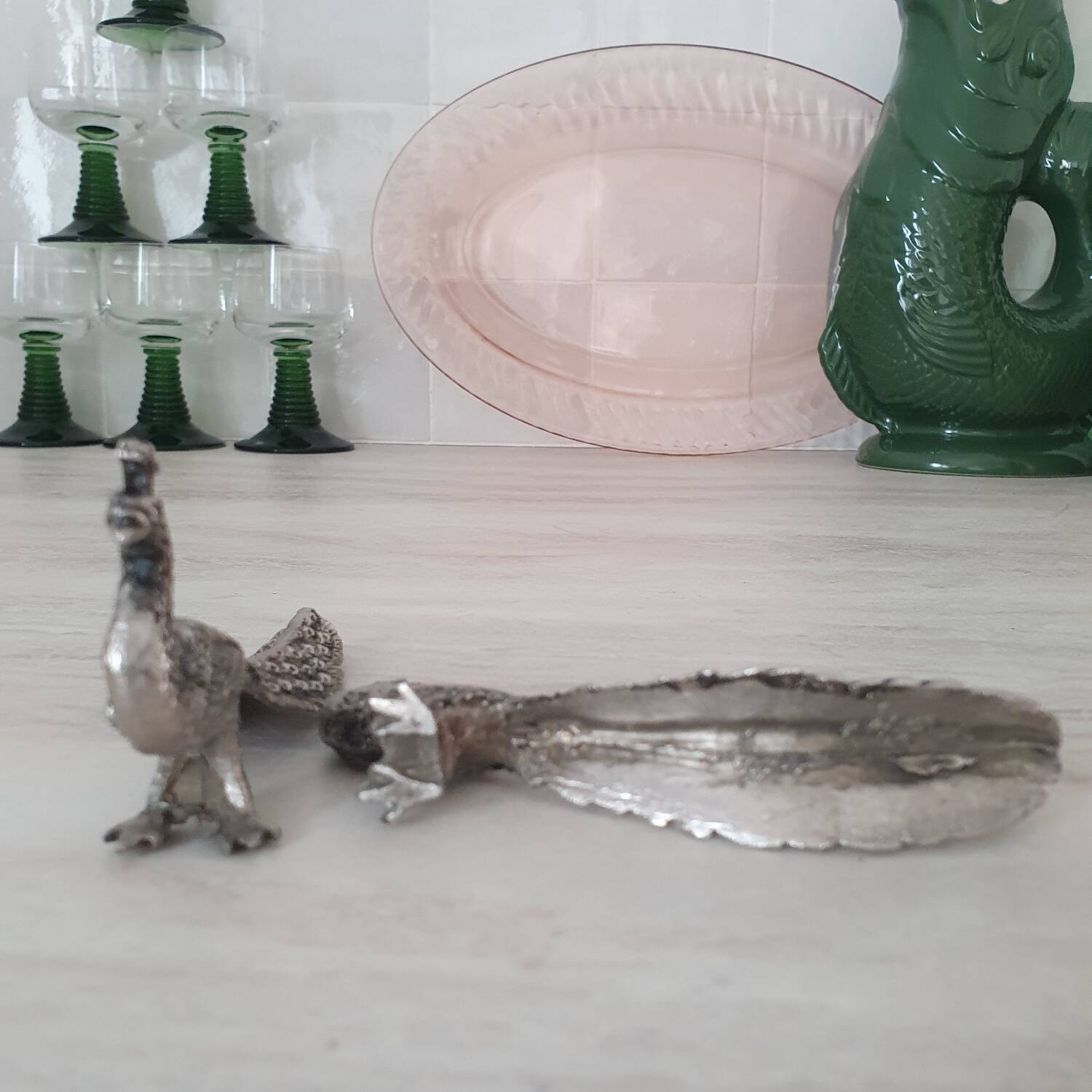 Silver metal peacock