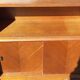 Vintage accent furniture in golden blonde oak with 2 sliding doors.