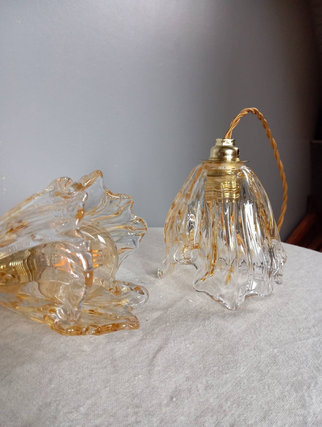 Pair of draped blown glass hanging lamps, ocher twisted wire