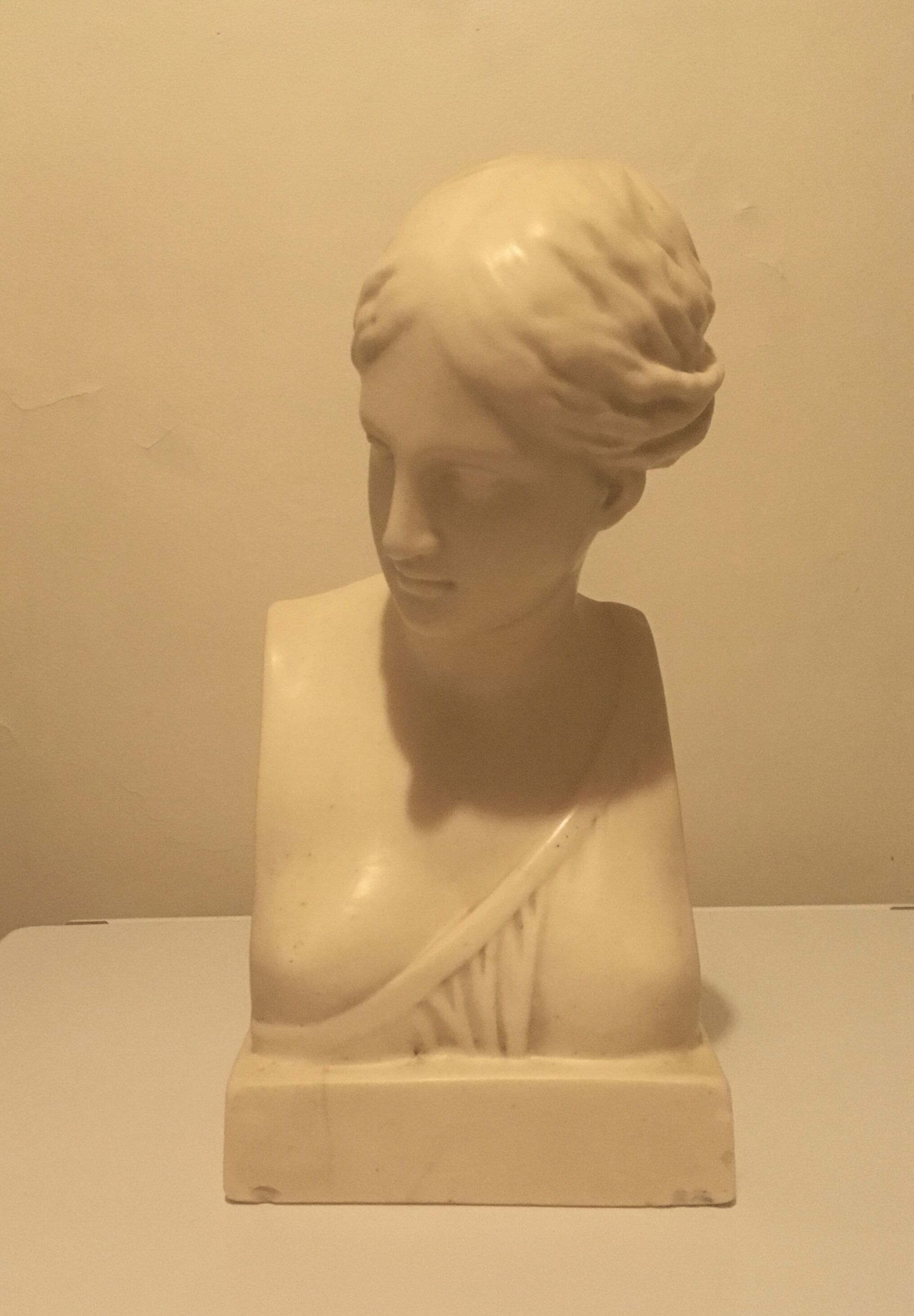 Bust of woman in off-white biscuit