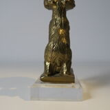 Brass sculpture, bear looking for honey in the tree