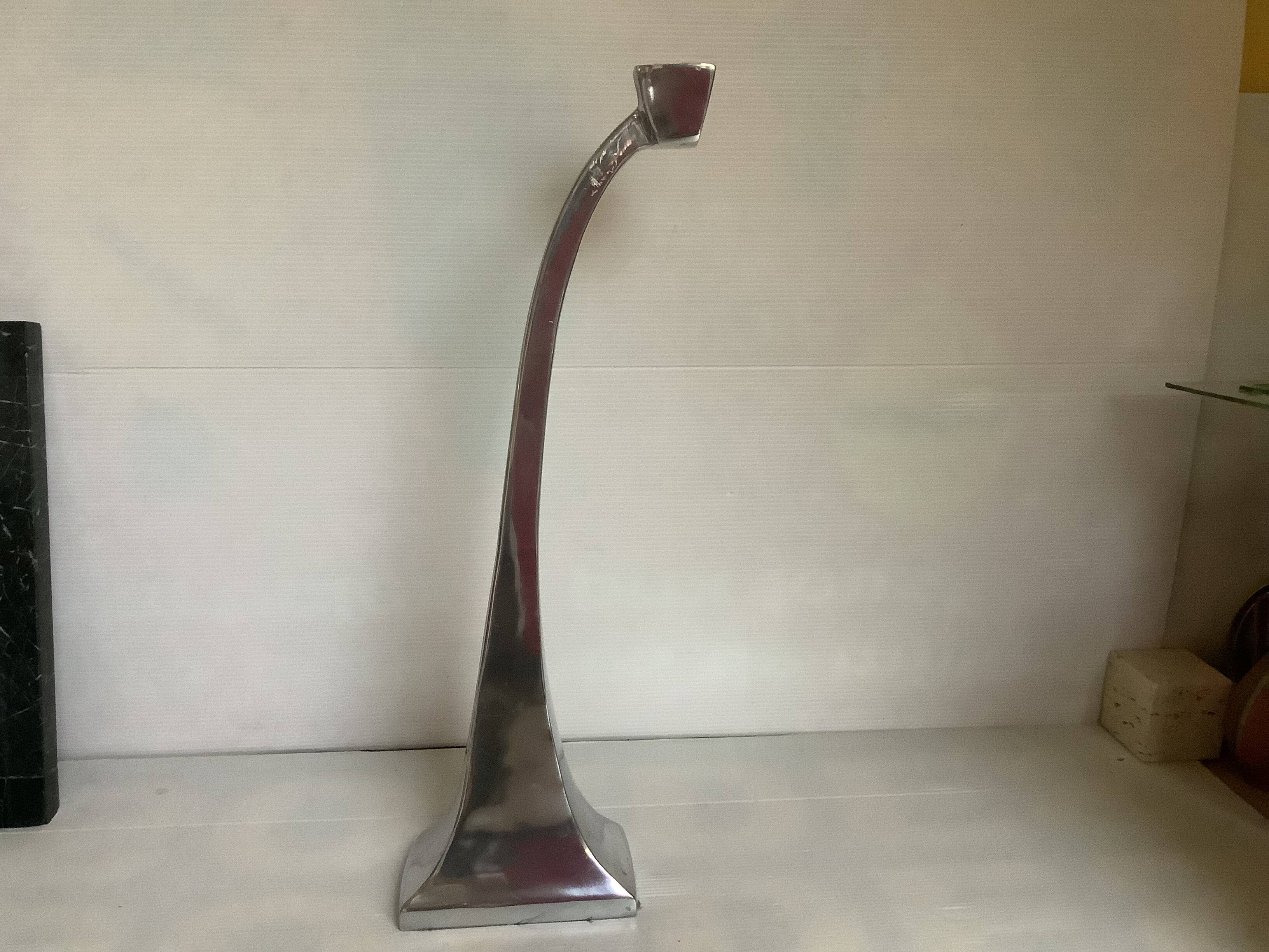 Large silver metal candlestick in the style of Xavier Lust
