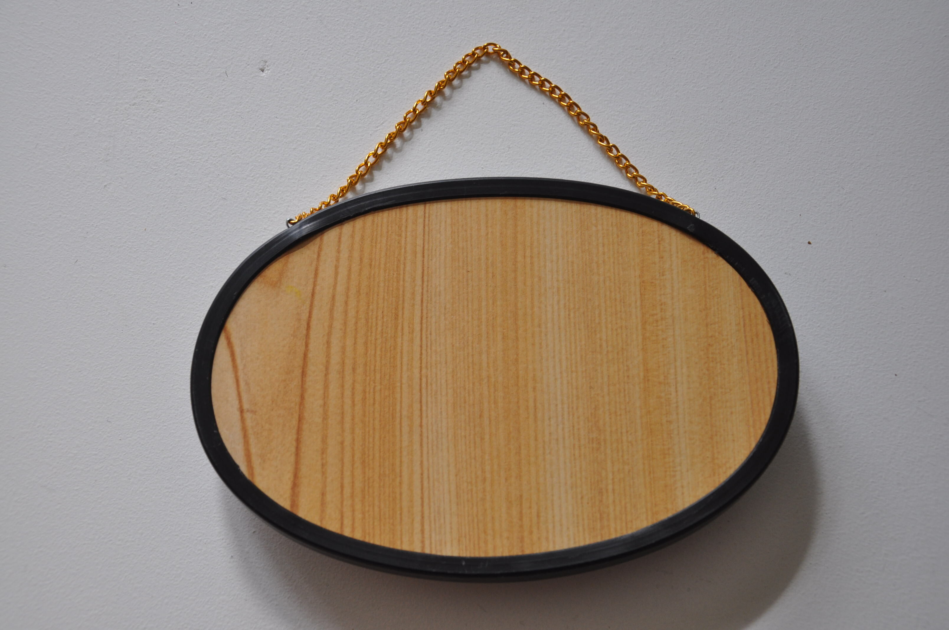 Butterflies in a bulging oval frame in vintage glass