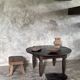 Antique round coffee table in Indonesian teak with turned legs.
