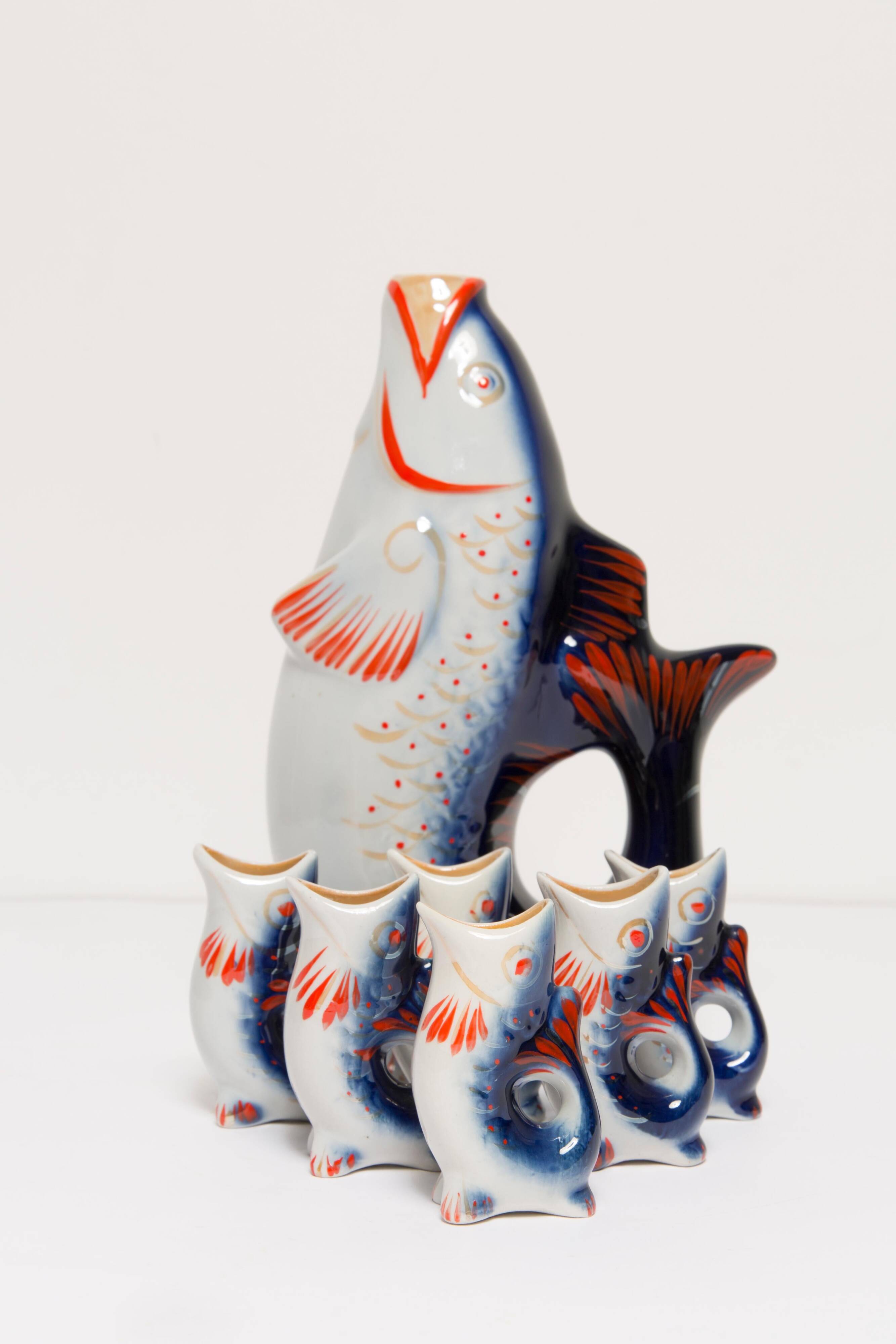 Set of 7 blue glass fish, mid-20th century.