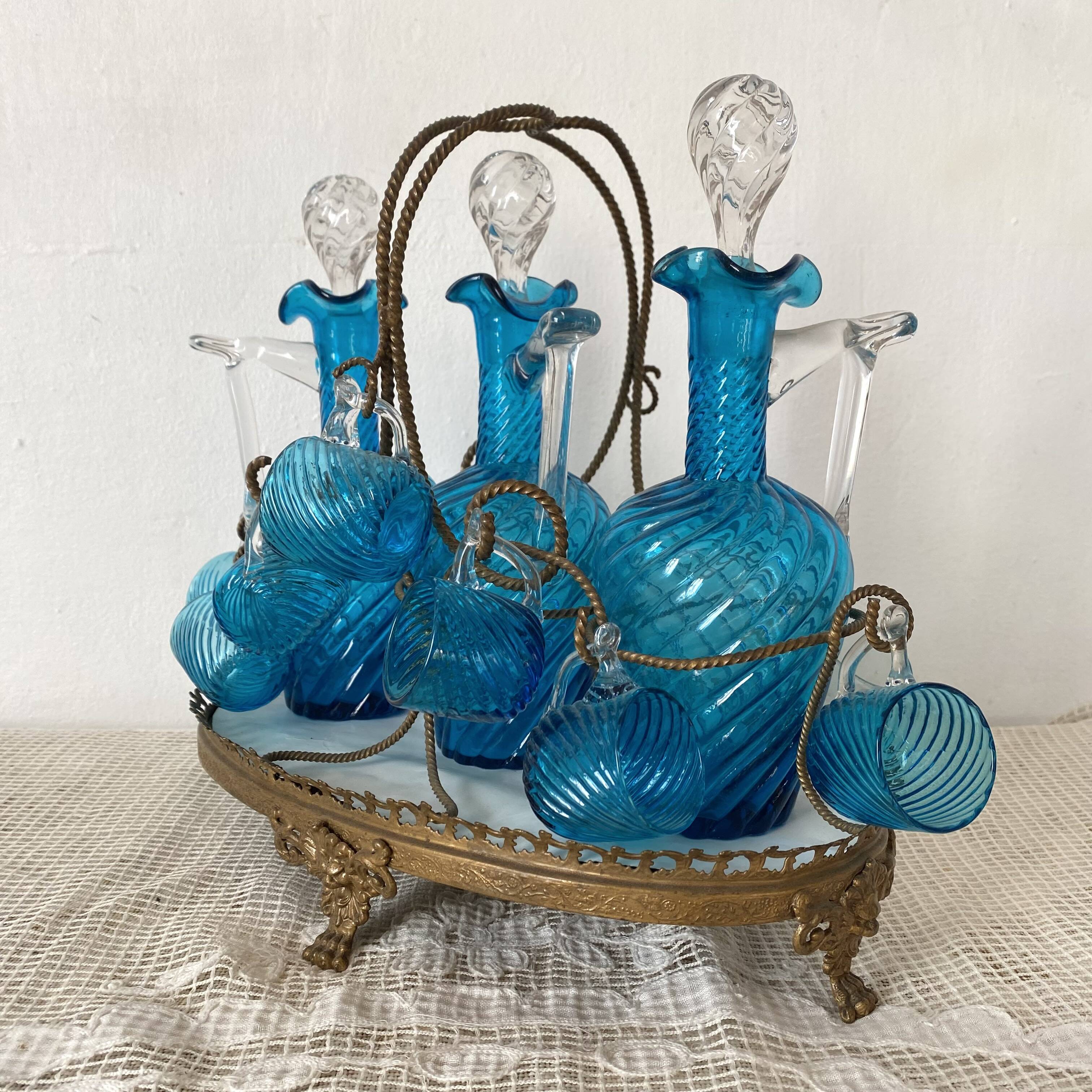 Antique Legras liquor cabinet, decanters and glasses, lion's paw stand