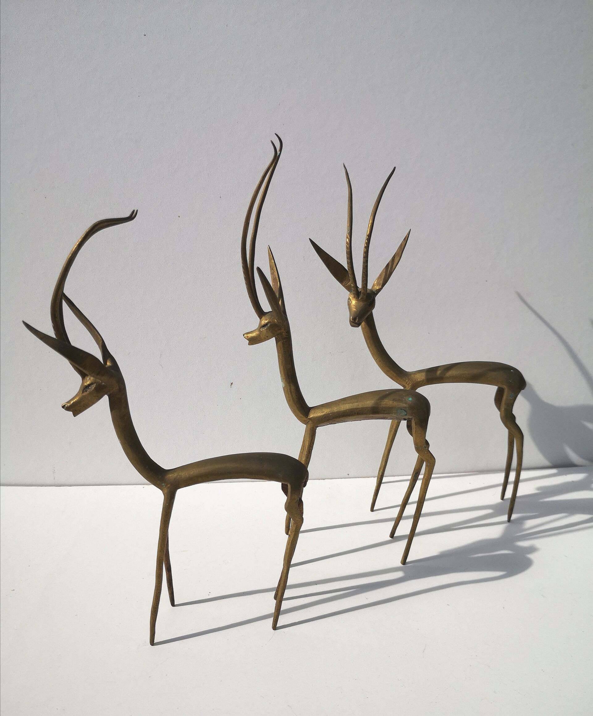 Trio of gazelles / solid brass antelopes