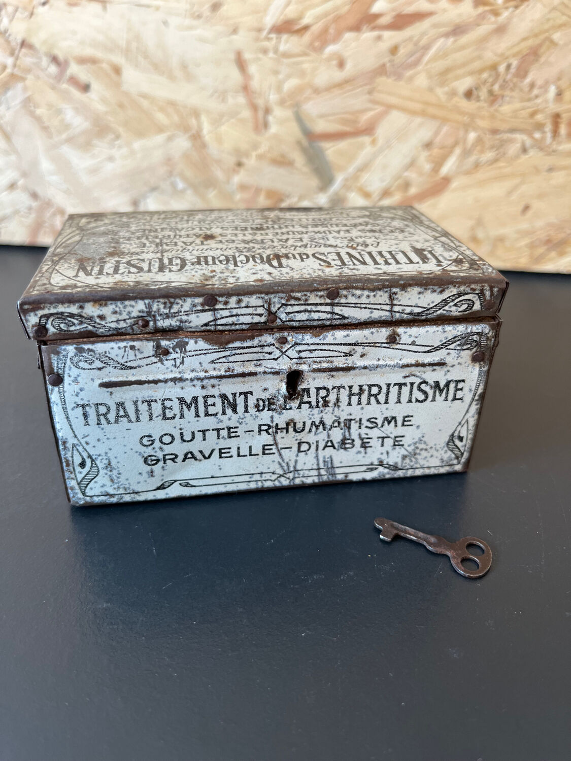 Old metal and wood medicine box with key