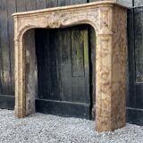 Louis XV style fireplace in marble Brèche D'alep