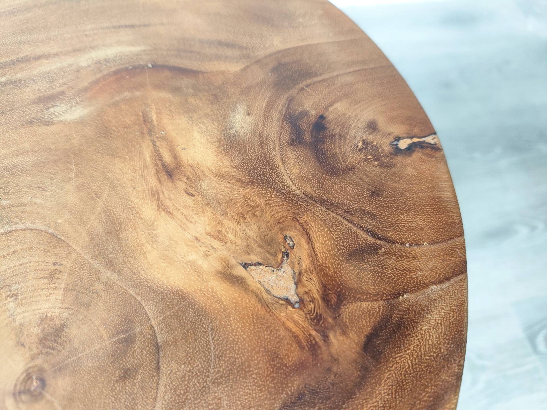 Minimalist side table in solid suar wood with conical legs.
