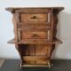 Small antique wall shelf with a drawer in light solid wood.
