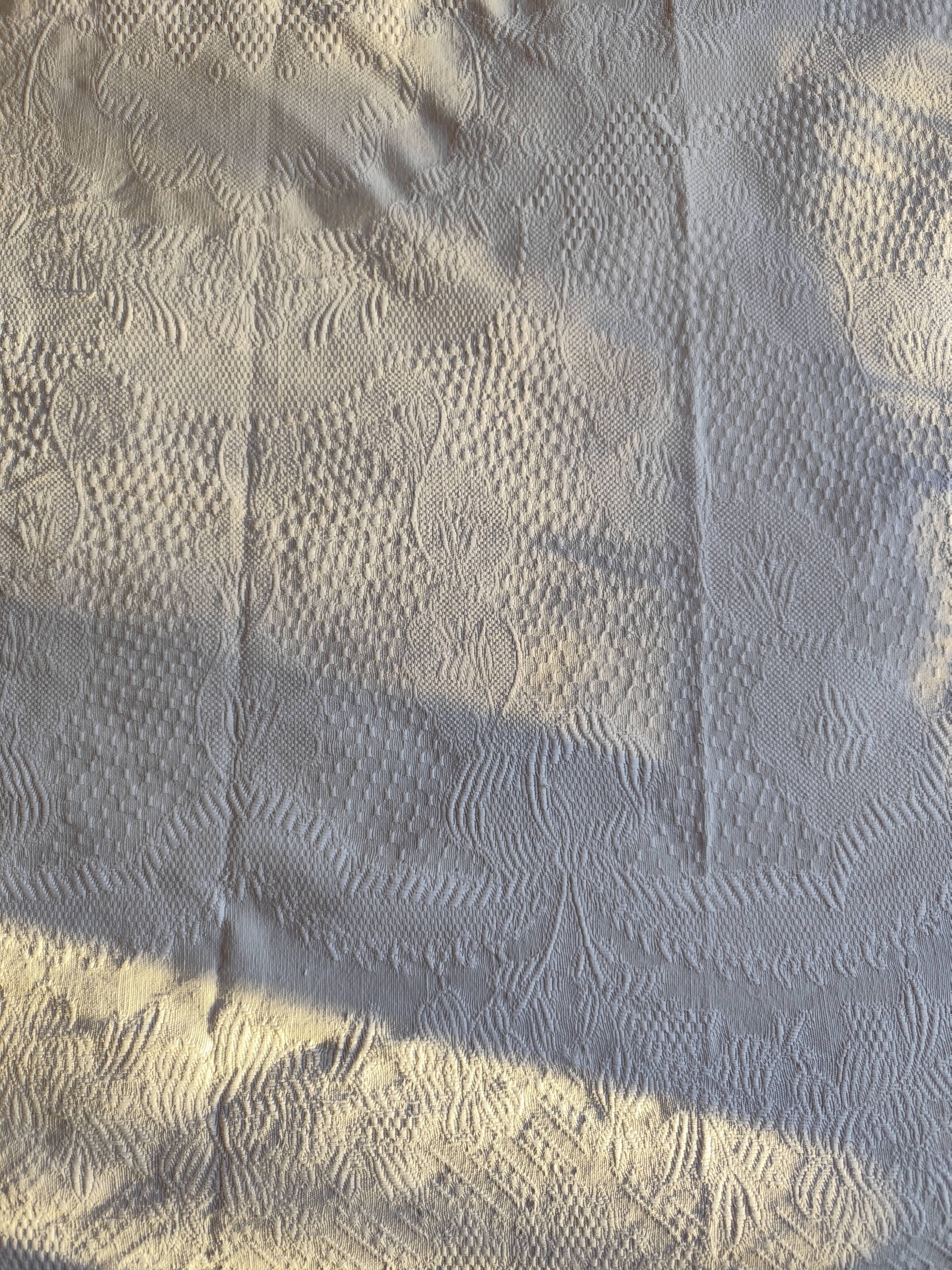 White woven cotton bedspread with fringes