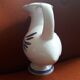 Zoomorphic vase in the shape of a bird made of Biot ceramic.