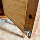 Vintage bedside table in wood & woven rattan